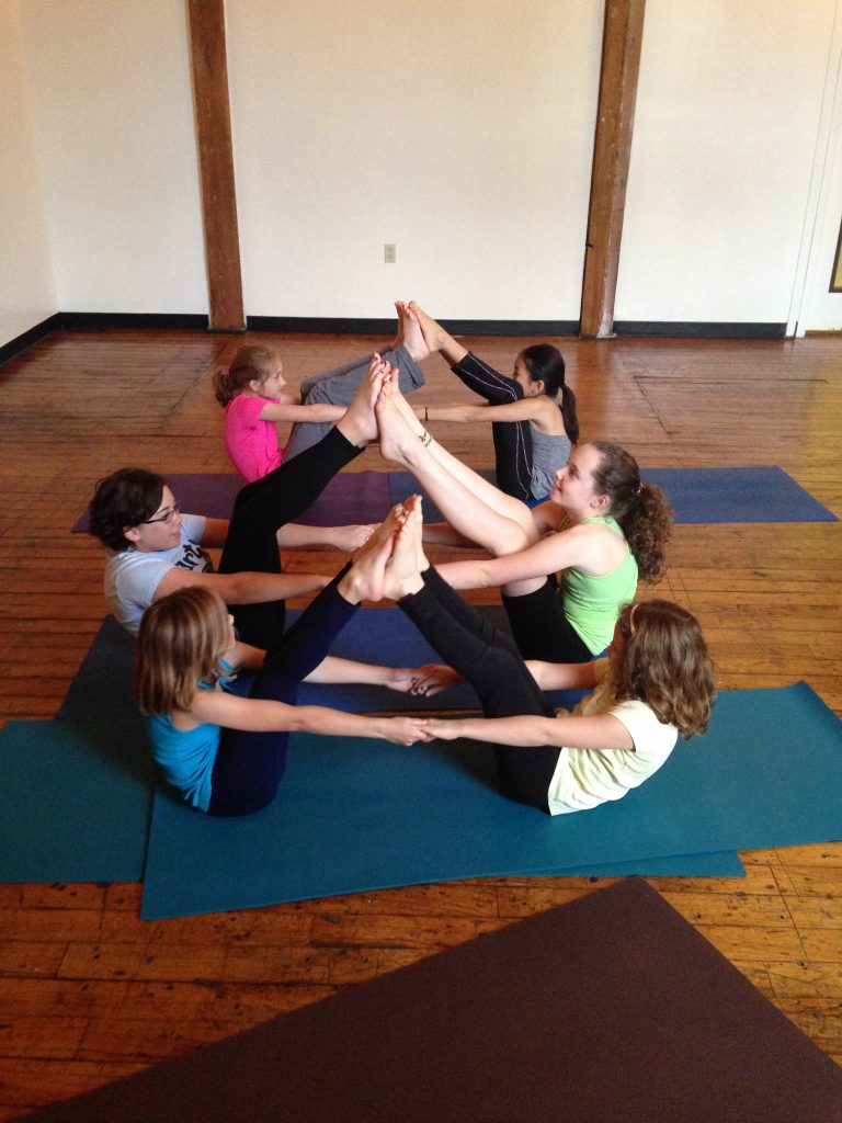 Yoga partner boat pose, Lil' Asana at Carrboro Yoga Company