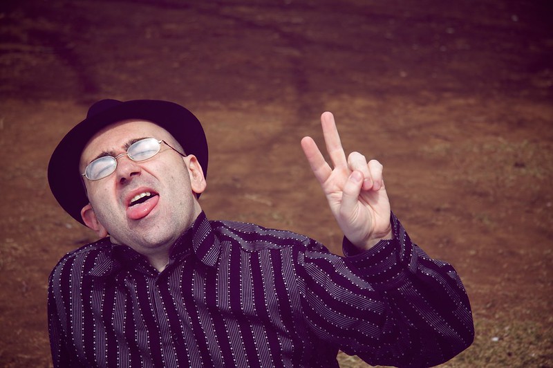 Guy holding up "peace" sign