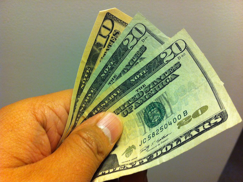 United States currency in hand