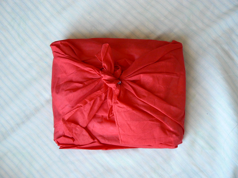 A gift wrapped in red paper