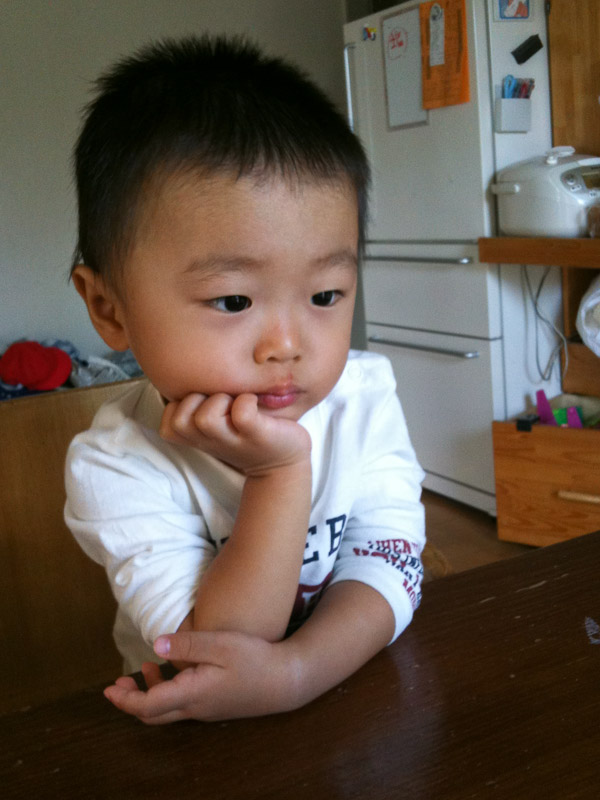 A little child pondering