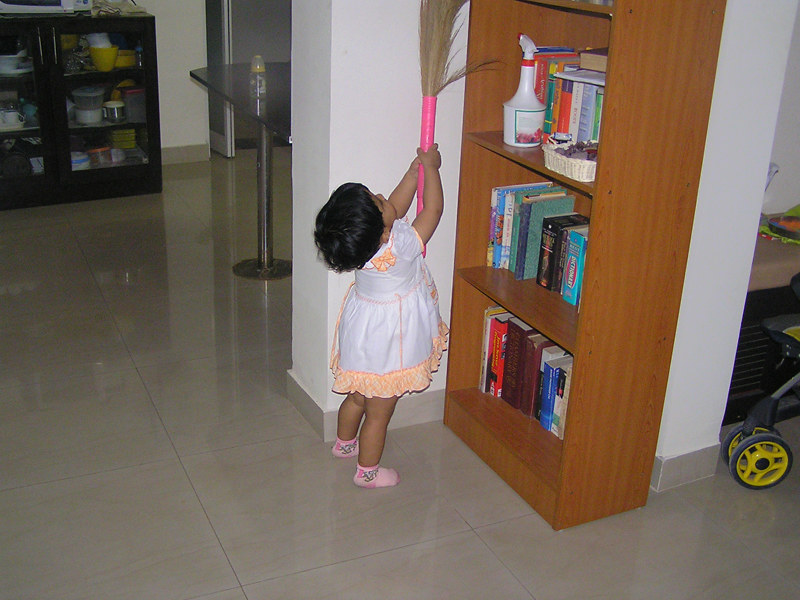 Little girl doing chores