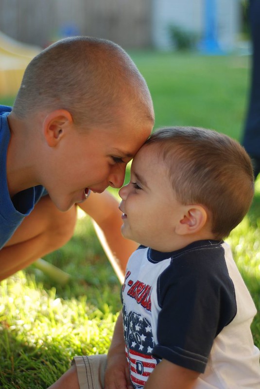 Two children share a moment