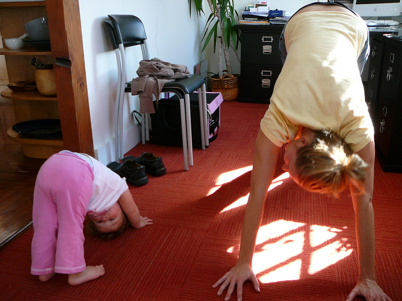 Downward doggie stretch with the kid