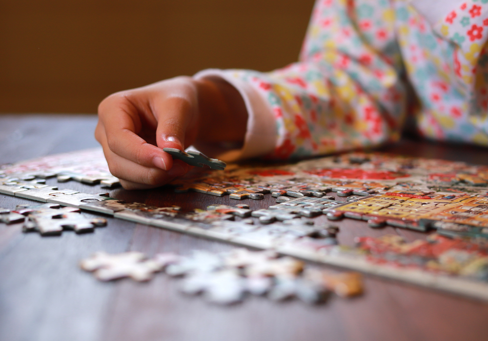 Jigsaw puzzle at the table