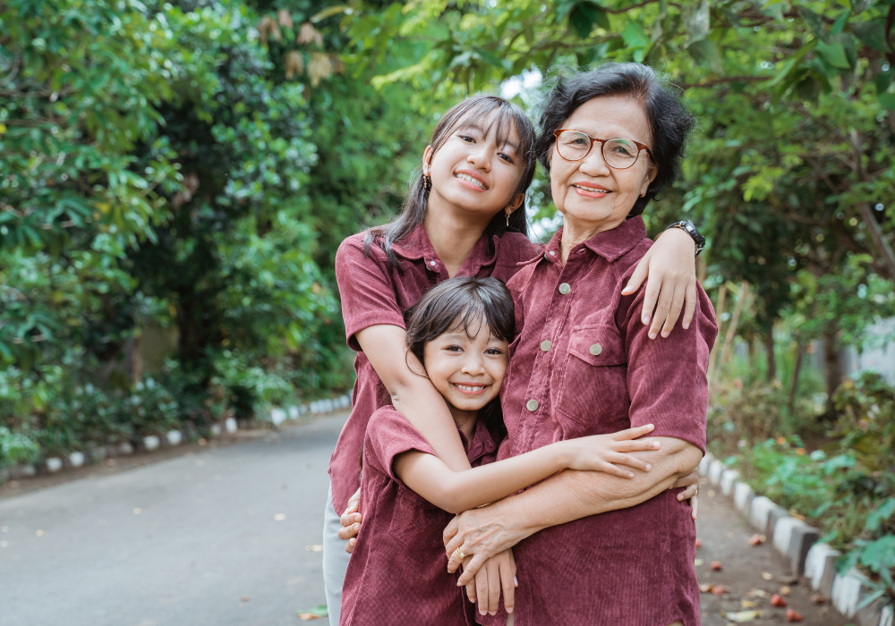 A family photo outside with the trees
