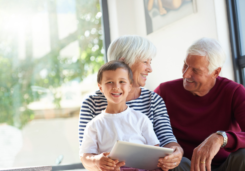 Grandma and Grandpa and their smiling grandson