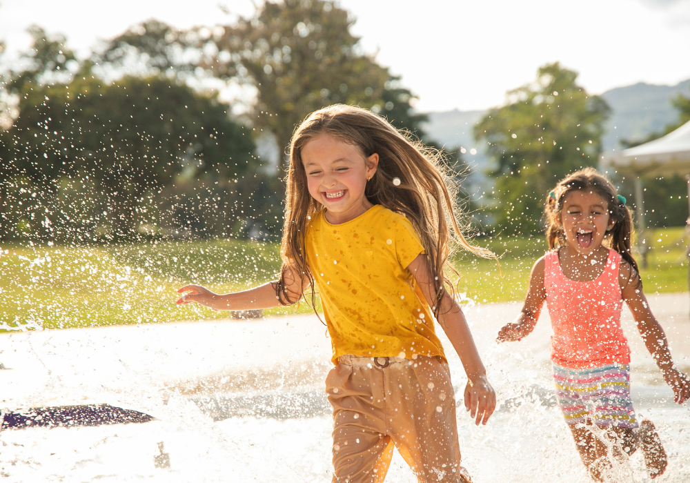 Children playing in the sprinkler