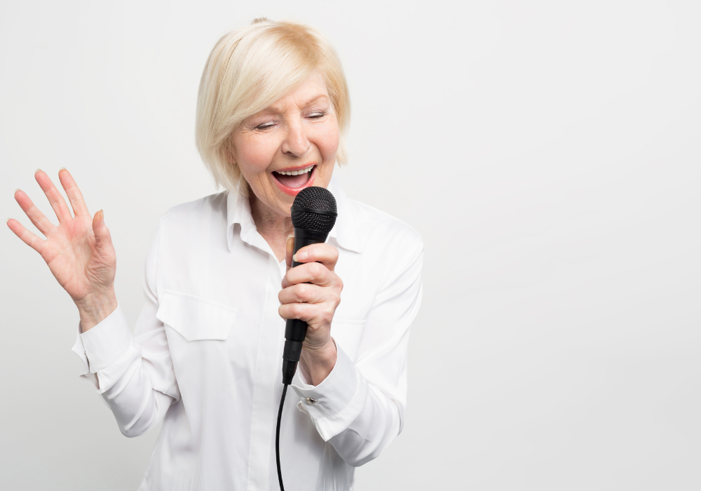 Woman singing into a microphone