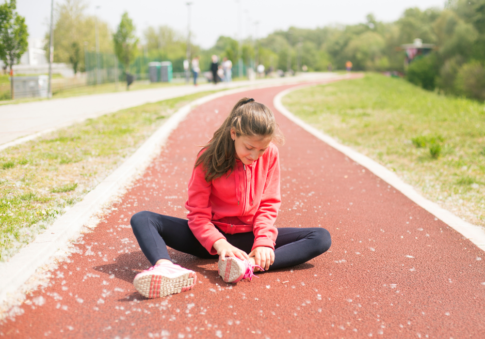 Sitting on the track after hurting ankle