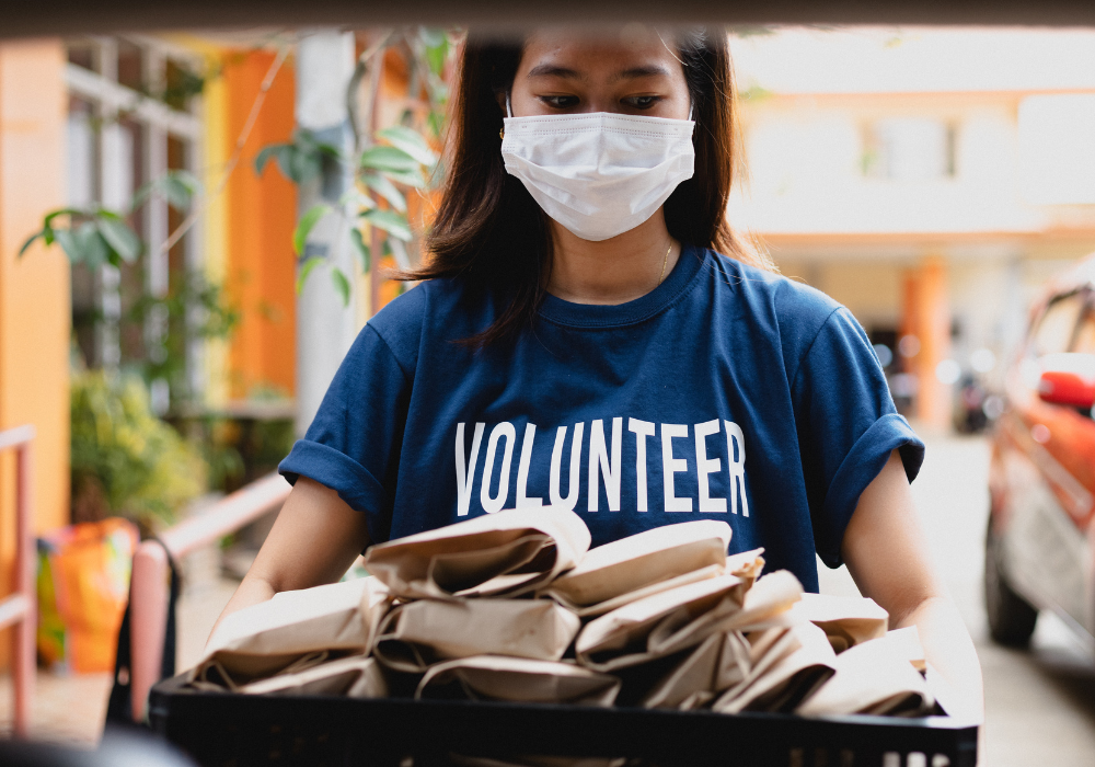Volunteer with care packages