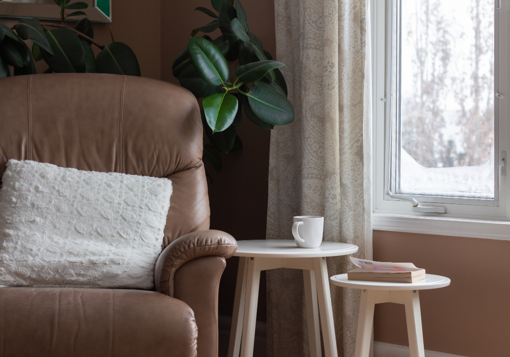 Cozy reading corner with chair and coffee cup
