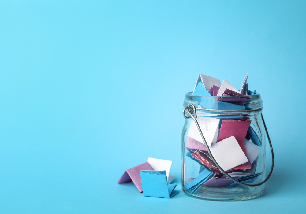Memory jar full of folded notes