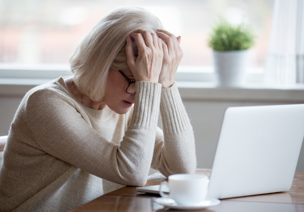 Frustrated woman on laptop