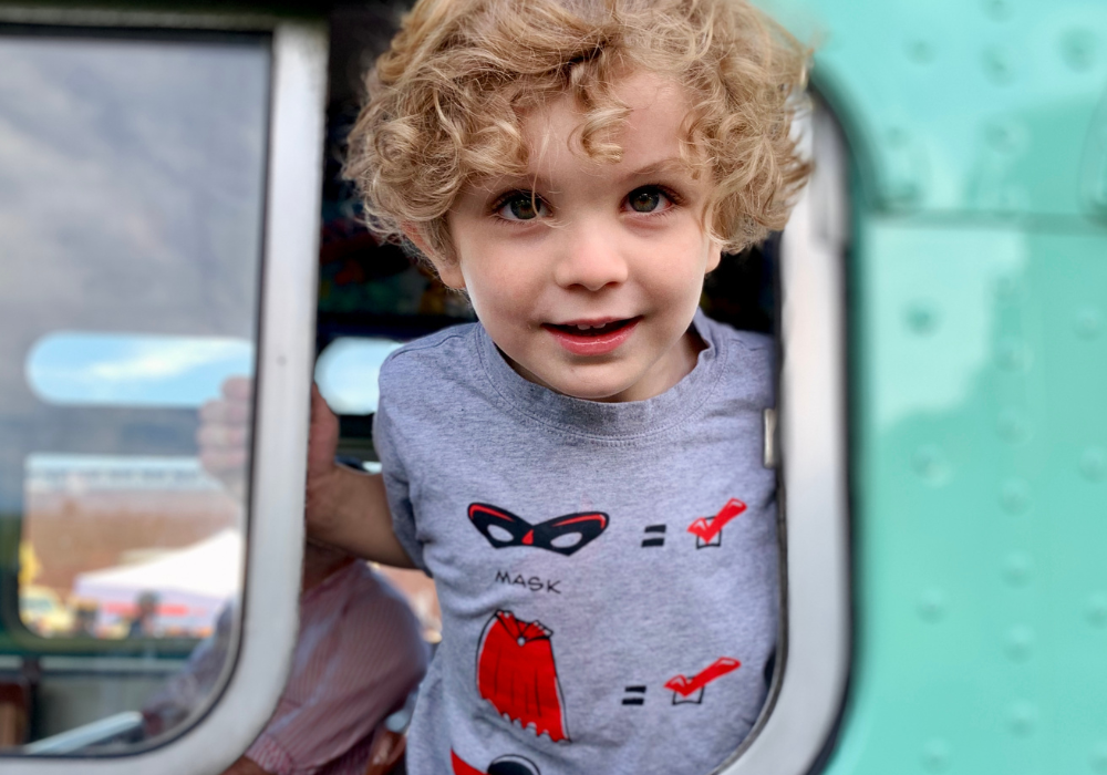 Kid sticking his head out the window