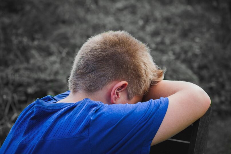 picture of a child looking depressed